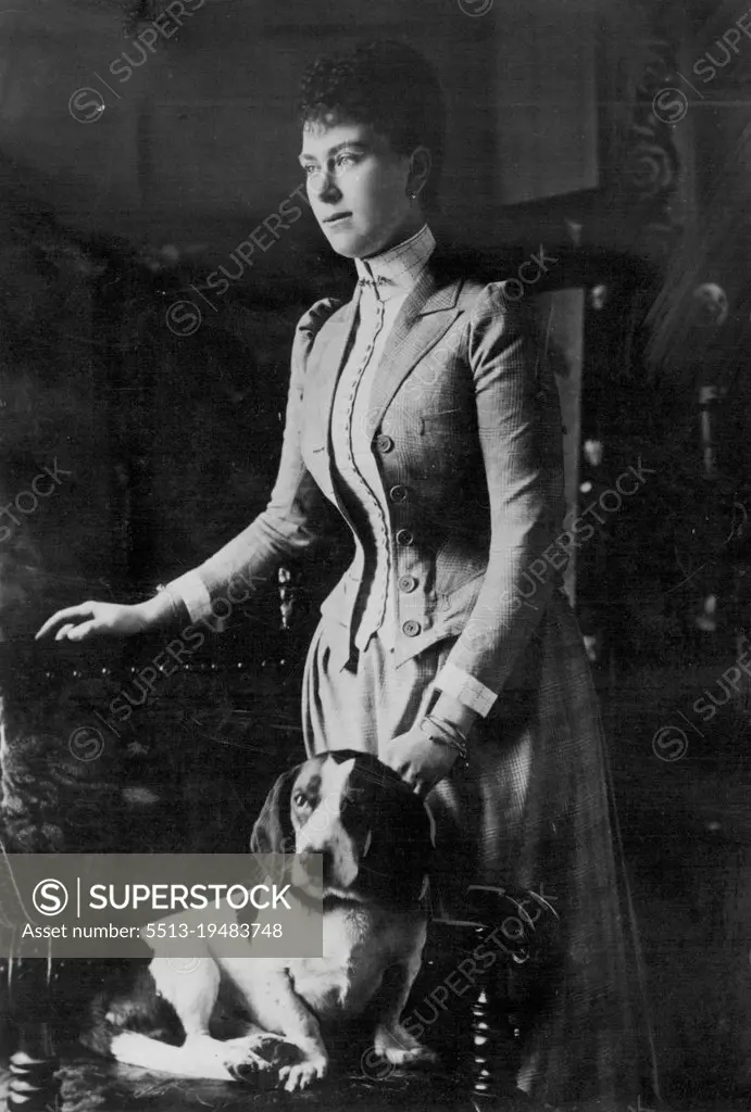 Princess May and her dog. This attractive portrait of Queen Mary in a beautifully cut tailor made of the period was taken just before her marriage in 1893. February 11, 1935. (Photo by Empire Press).