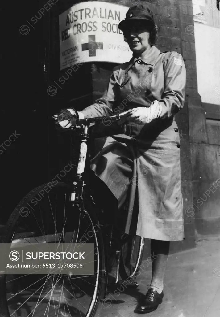 A uniformed Red Cross cycle service has been formed in Melbourne. Fifty girls, using their own cycles, will deliver messages, and will be used in time of emergency. Above: Miss D. Walsh leaving Red Cross house today. February 19, 1942.