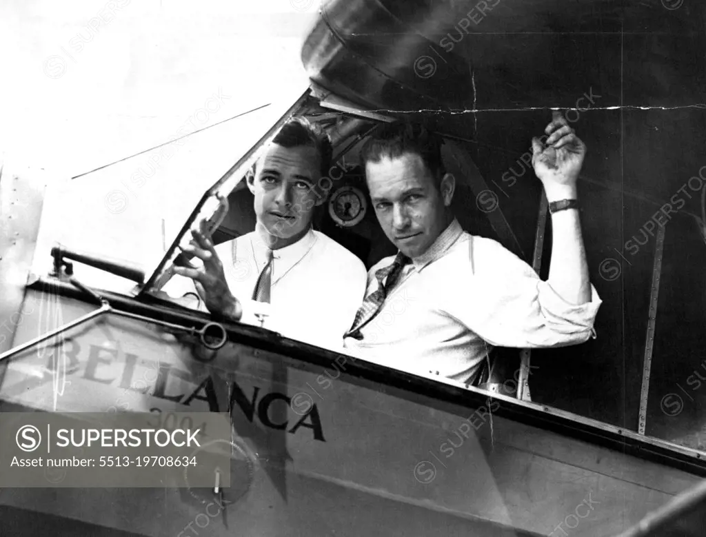 On Your Mark--Get Set --
Hugh Herndon, left, and Clyde Pangborn in the Cockpit of their plane all set for their contemplated hop across the Atlantic ocean. They will most likely be the newest members to the exclusive "Ocean-Crossers" club whose ranks have swollen this year in unprecendented fashion. They will try to Gridle the Entire Globe. June 26, 1931. (Photo by International Newsreel Photo).