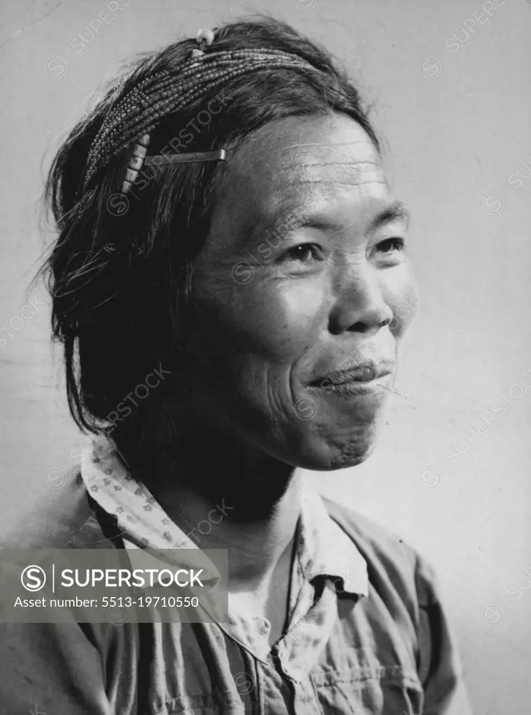 Igorot woman of the Mountain Province porch Luzon. March 04, 1954. (Photo by Chas. W. Miller).