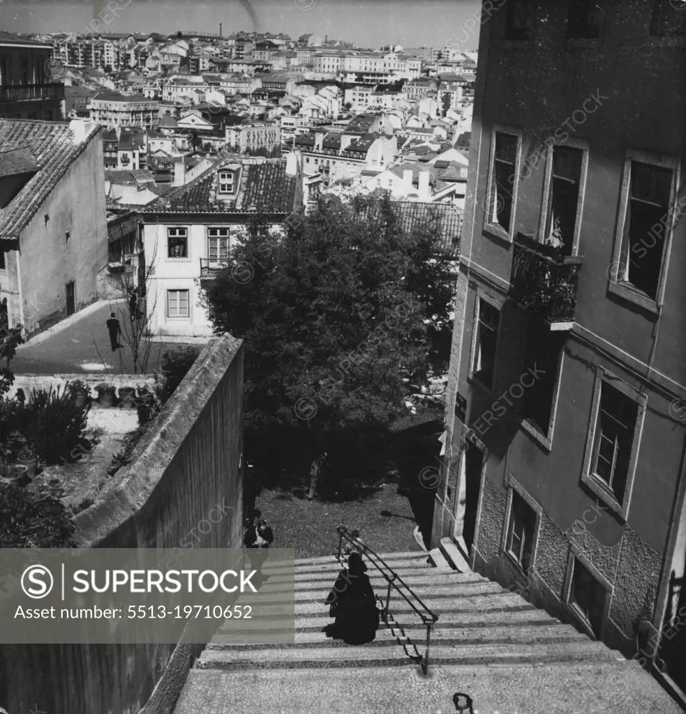 Lisbon 1952 -- In the old part of the town there are many narrow, steep and winding alleys, such as this one that overlooks the more modern quarter of the city. February 27, 1952. (Photo by Camera Press).