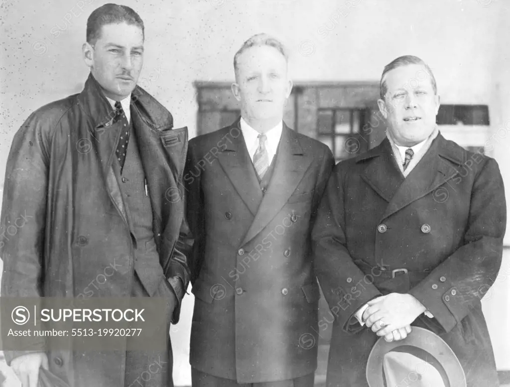 Pond May Enter Australian Race - Captain George Pond, shown here (right), as he arrived in New York Oct. 13 aboard the liner president Roosevelt, said he would look for a plane to enter in the London to Melbourne air race which starts Oct. 20. on the left is Warren Penny, a Sydney, Australia radio announcer, who will fly with him. Arthur Finch is in the centre, pond, who recently attempted a flight from harbor grace to Rome with Cesare Sabelli, said he might have to fly the Atlantic to reach London in time for the start of the race. October 13, 1934. (Photo by Associated Press Photo).