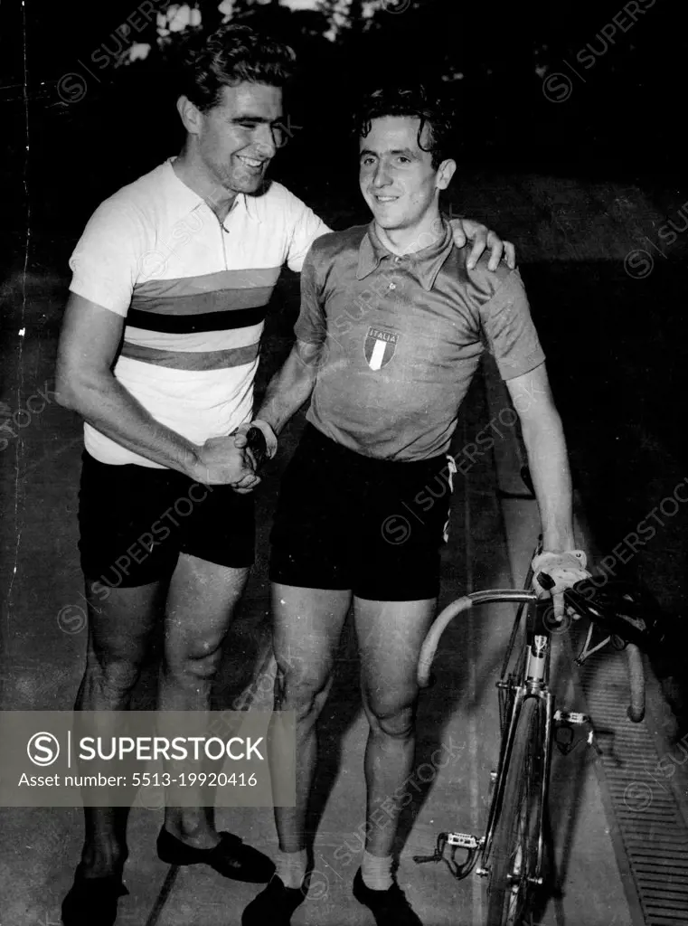 Congratulations: Aldo Gandini (right) shakes hands with Syd Patterson of Australia at Rocour Stadium, Liege, Belgium, Aug. 15, after Patterson had beaten Gandini in the final of the world Amateur Pursuit championship. Second place went to Gandini. Patterson's time was five minutes 12.1 seconds against Gandini's five minutes 13.1 seconds. Patterson wears the champion's sweater, colored with red blue yellow green and black bands on a white base. August 23, 1950. (Photo by Associated Press Photo).