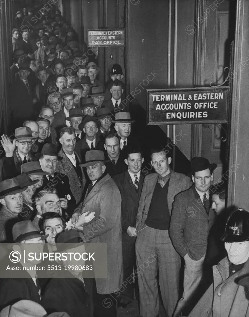 Tramway men receiving then has for the lost week of work. October 28, 1946.