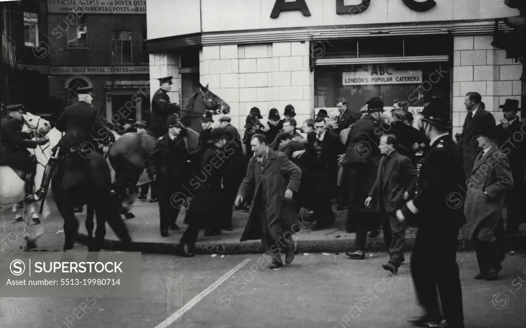 Dockers Trail At The Old Bailey -- Mounted and foot police clearing demonstrators during the disturbances, outside the court.Disturbances Outside Court. Disturbances took place outside the Old Bailey in London, during the closing stages of the trial of the seven clock-workers accused of illegal conspiracy to incitement men to take part in illegal strikes. April 17, 1951. (Photo by Sport & General Press Agency, Limited).