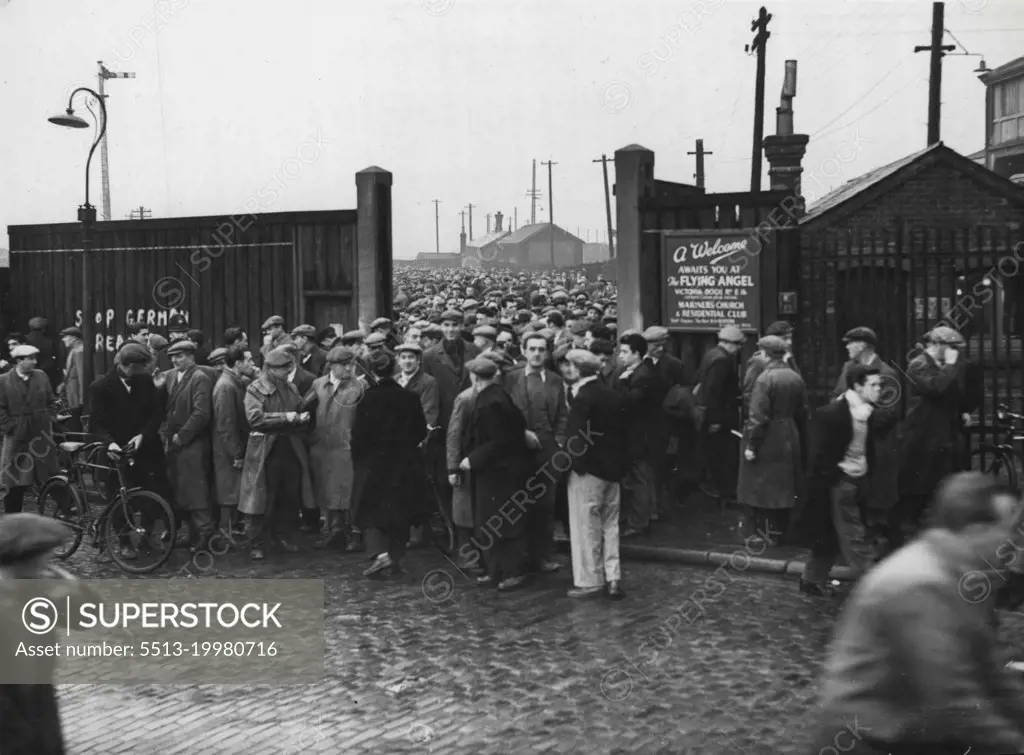Back To Work -- And Now Too Many Dockers -- Dockers back to work at the Royal Albert Docks to-day.Forty-four Thousand dock strikers reported for duty today - but there was not work for all of them. At London; Southampton, Merseyside, Birkenhead and Hull all the men reported for work. There was a full resumption of work except at London, where a National Dock Labour Board spokesman said that there was a "surplus of labour" all over the docks. Of the 26,000 men who lied up outside the dock gates more than 2,000 found themselves without jobs when they got to the call stands. At the Royal Group about 1,050 men found themselves unemployed - about one-fifth of the pool strength. November 1, 1954. (Photo by Daily Mail Contract Pictures).