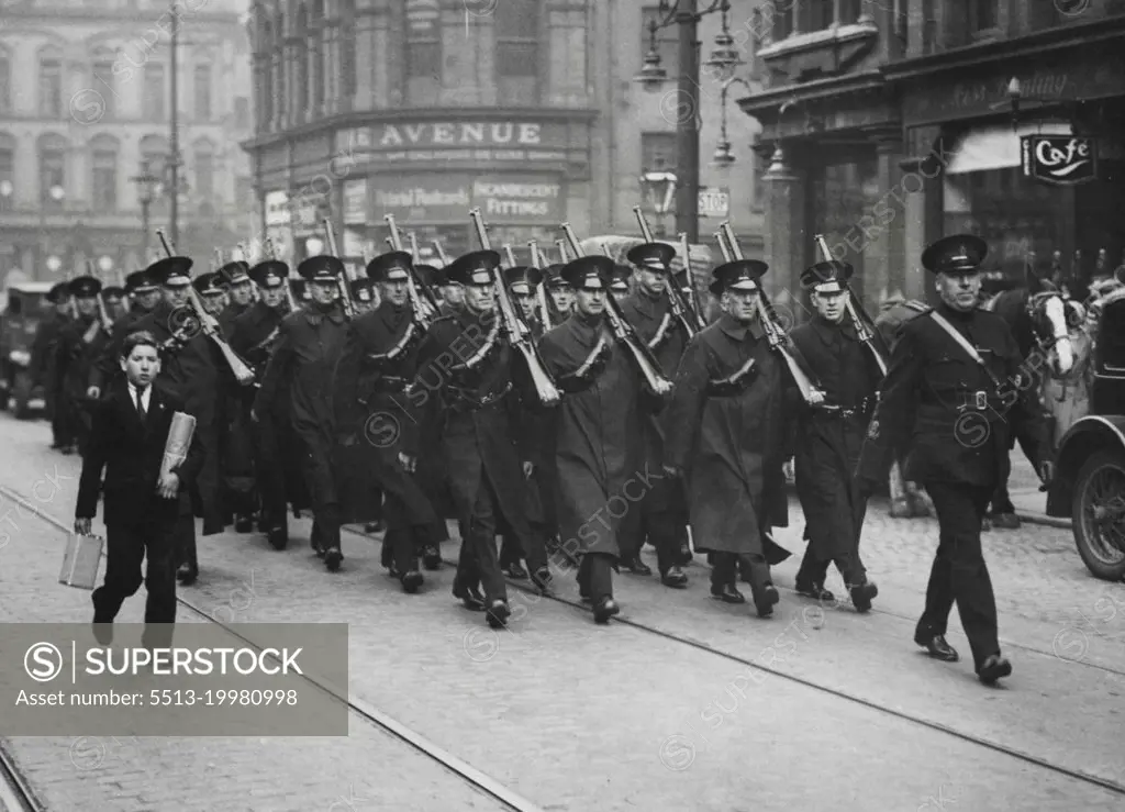The Riots in Belfast -- ***** armed with rifles and revolvers patrolling a troubled ***** area. November 21, 1932. (Photo by Central News).