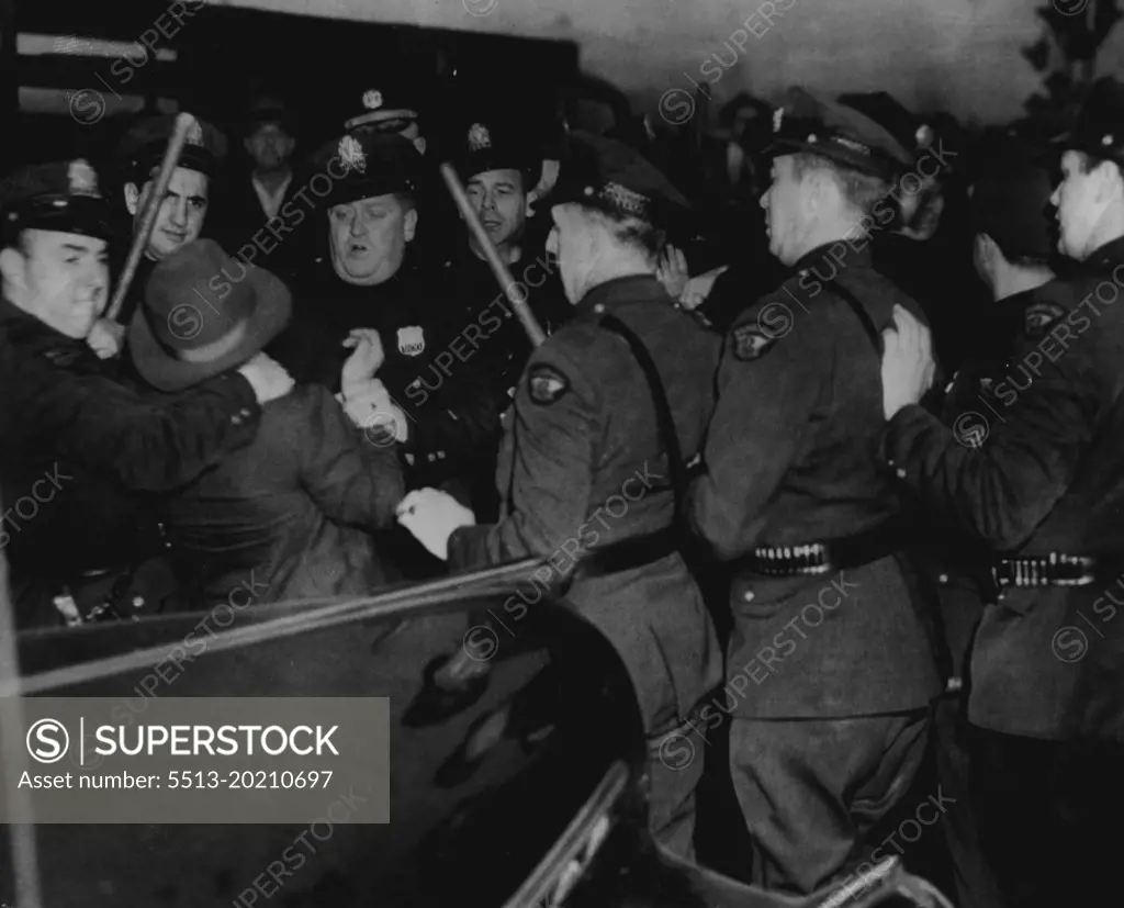 Violence Flares At SKF Plant -- Police Remove a picket today at the strike-bound SKF plant here after a scuffle which occurred when pickets attempted to keep automobiles carrying office workers from crossing their lines. October 23, 1945. (Photo by AP Wirephoto).