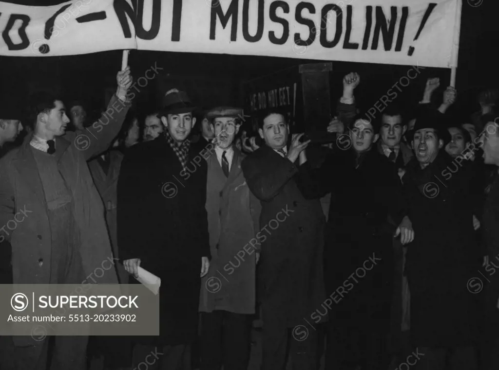Premier Leaves For Rome - Unemployed stages a demonstration among the cheering crowds at Victoria station to-day as Mr. Chamberlain and Lord Halifax, the Foreign secretary, left on the first stage of their journey to Rome for talks with Mussolini,Demonstrator outside Victoria with the famous black coffin and banner "Appease the Unemployed, not Mussolini". January 10, 1939. (Photo by Sport & General Press Agency, Limited).