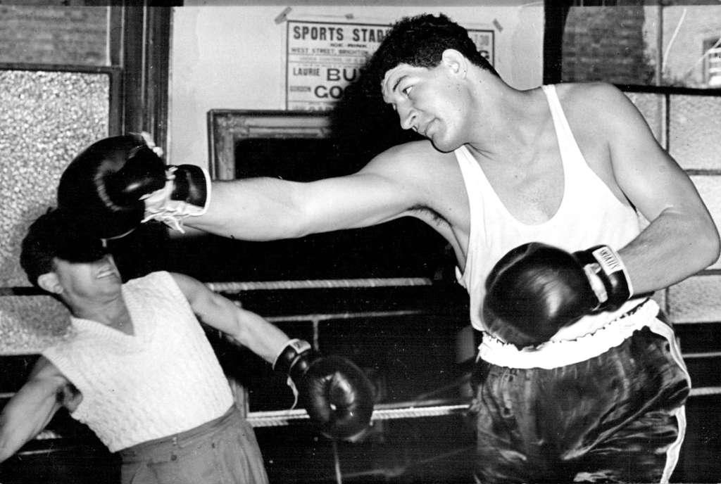 Giant South African Boxer To Have His First Contest In England. Ewart Potgieter in action during training. Ewart Potgieter, the giant South African heavy weight boxer, is now finishing off his training in readiness for his contest against Simon Templar at the White City Stadium, London. September 12, 1955. (Photo by Sports and General Press Agency Limited)