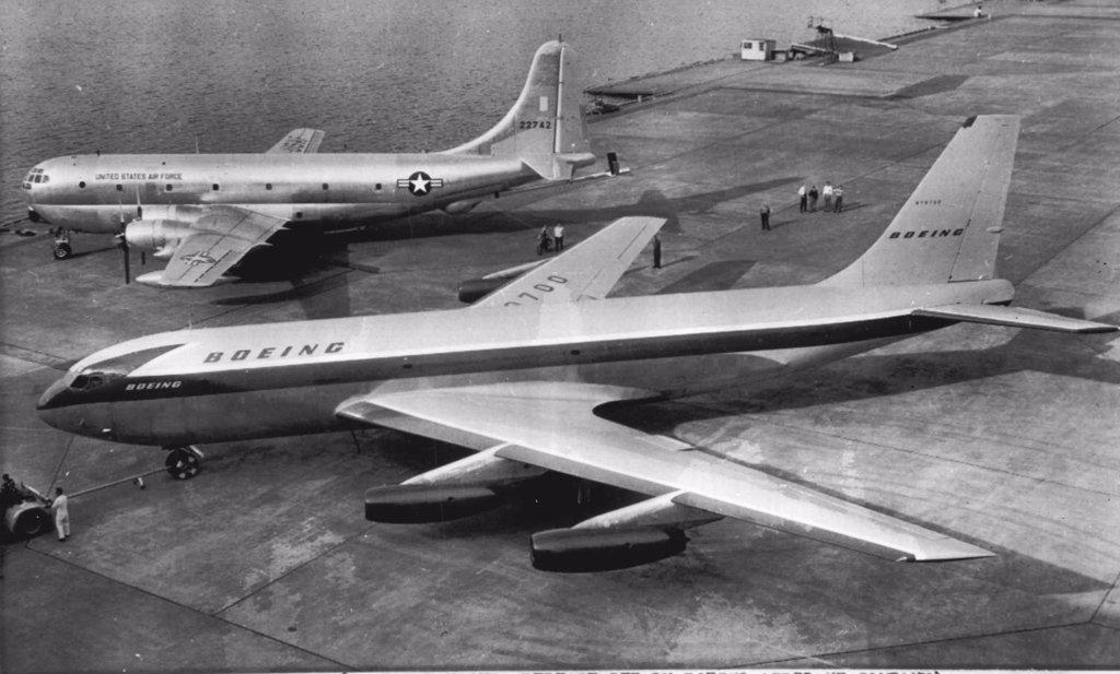 A Couple of Big Birds -- The new Boeing prototype Stratotanker, foreground, is hauled into place alongside a U.S. Air Force tanker-transport, the Boeing KC-97G Stratofreighter, at Renton, Wash. The Stratotanker jet will carry from 80 to 130 passengers in its airline version. The new aircraft will be used in tests to demonstrate its capabilities as a military tanker transport each developing more than 10,000 pounds of thrust, will power the aircraft. Its cruising speed is 550 miles per hour. May 18, 1954. (Photo by AP Wirephoto).