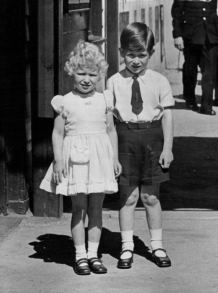 The Holiday Is Over -- The Royal children provided this charming study on Monday, May 31st, as they posed for the cameramen outside Ballater Station.
The Royal Children, Prince Charles and Princess Anne, have been enjoying a holiday at Balmoral, Scotland, with their parents, the Queen and Duke of Edinburgh, but holidays must come to an end so the young children are driven to ballater station for the long journey to London. June 02, 1954. (Photo by Paul Popper; Paul Popper Ltd.).