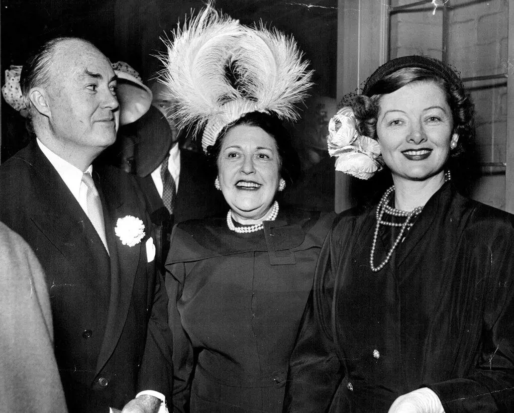 The Markey, once married to the bride's mother, with Myrna Loy, his fourth and present wife. The fabulous creature between them is Louella Parsons,  columnist, whose powerful grip on the industry has relaxed somewhat of late - to the stars relief. September 01, 1948.