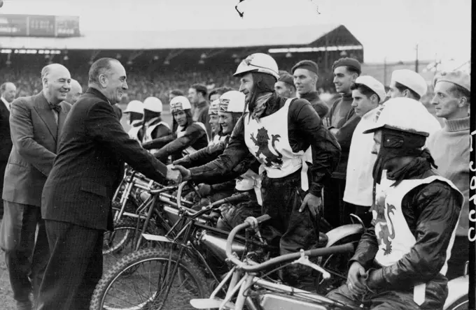 England Defeat Australia in Fourth Speedway Test Match: The Hon. Eric J. Harrison, Australian High Commissioner, shaking hands with Ron Clarke, when being introduced to the English team before the match. England defeated Australia by 62 points to 46 in the fourth Test Match at the Wimbledon Speedway, London. August 01, 1950. (Photo by Sport & General Press Agency, Limited).