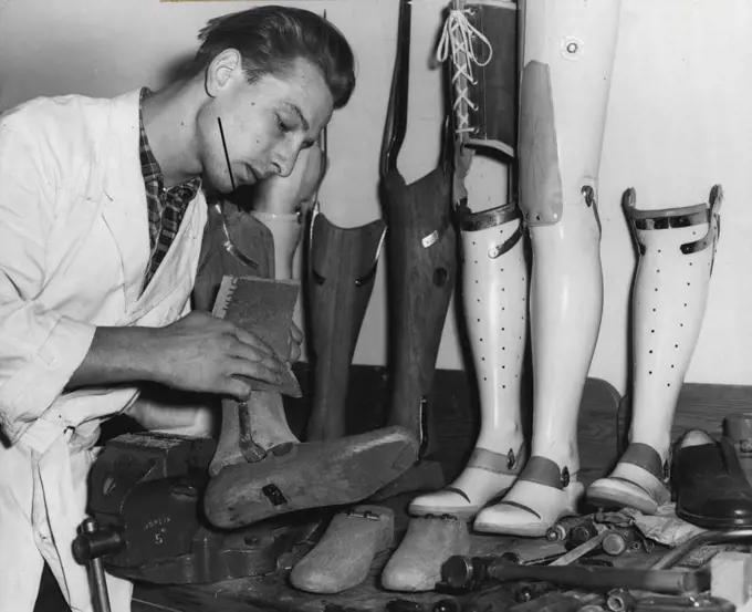 Artificial Limb Specialists -- Mr. Gunter Kairies of Herne Bay, an orthopedic mechanic (or artificial limb maker) working on a leg at the A.L.A. Co. at Carlton. November 02, 1955. (Photo by George Lipman/Fairfax Media).