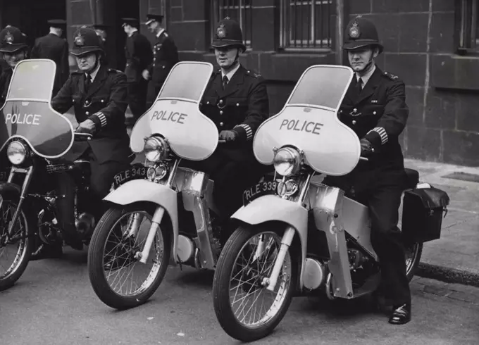 Mechanised On The Beat Two members of the new patrols seen at Scotland Yard today. They are (left to right) B.C. Eric Grabb of Walthamstow and P.C. Raymond Baldwin of Finchley. Their motorcycles, with silent engines, have the word "Police" across the windscreens. The vehicles being used in this new scheme are velocette L.E. and Triumph Terrier. The patrols will operate in Norwood Green, Finchley, Croydon and Walthams tow. Sixty policemen riding lightweight motorcycles are to begin a new type of patrol in four London areas, each man covering several of the beats normally patrolled by a foot policeman. September 16, 1955. (Photo by Fox Photos).