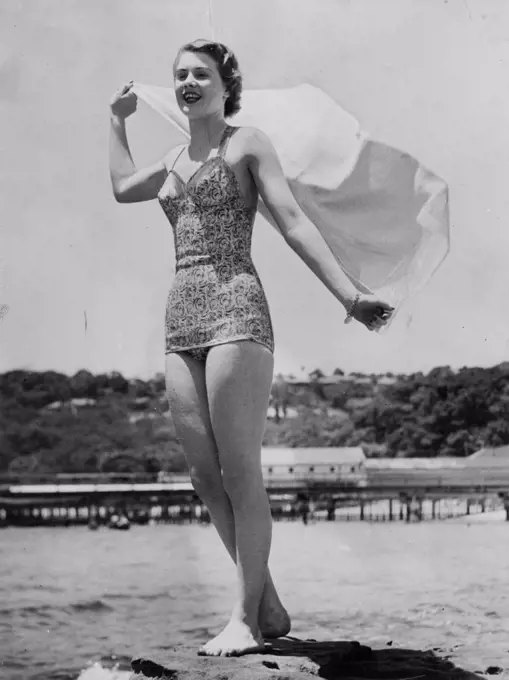 Lovely study of Miss NSW, Margaret Hughes, enjoying the sea breeze at Balmoral. December 5, 1949.