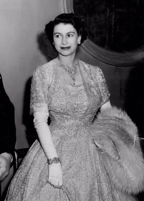 Princess At The Ballet. Princess Elizabeth, in a striking crinoline gown, pictured when with the Queen, she attended a gala performance of Frederick Ashton's new ballet "Tiresias" at the Royal Opera House, Covent Garden. The performance was held in aid of the Sadler's Wells Ballet Benevolent Fund. July 9, 1951.