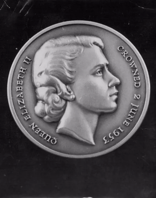 Front of The Sunday Sun Coronation medal shows charming engraving of her Majesty the Queen. April 5, 1953.
