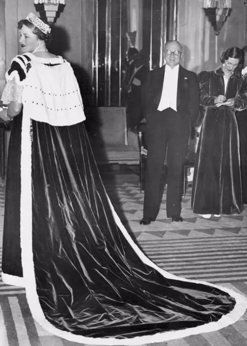 Coronation Robe -- London is coronation-minded and his coronation robe attracted much attention when worn at a charity ball, attended by the Duke and Duchess of York. November 21, 1936. (Photo by Sport & General Press Agency, Limited)