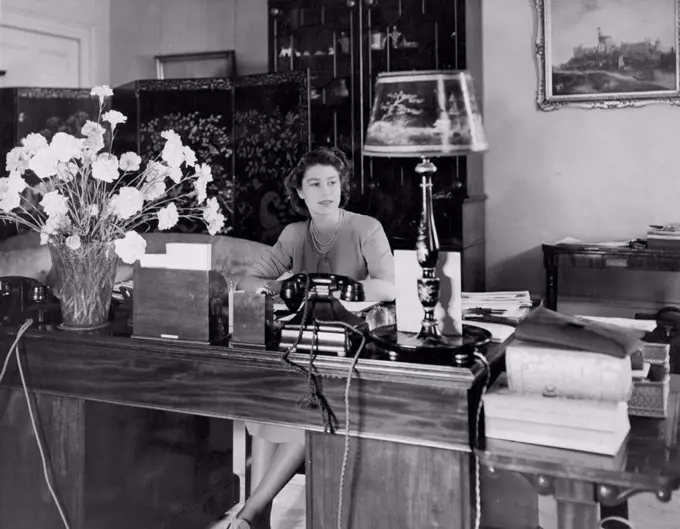 Queen Elizabeth at desk. July 1, 1946. (Photo by Camera Press Ltd.).