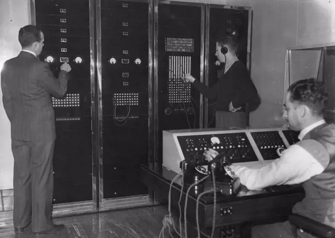Control room is large part of what makes station tick. (L to R) Engineer Burt Munnings, Technician P. Seaton & Control operator Basil Pierremont on control panel. July 5, 1951.