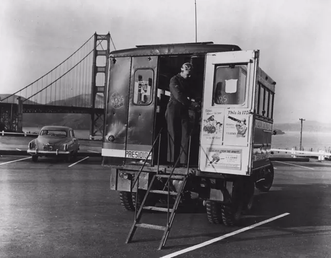 Mobile Minute Men -- This ***** mobile unit is being opened for ***** inspection near the Golden Gate Bridge in San Francisco, California. Nearly 3,000 amateur radio operators are ***** in a manner ***** contributes to the defense of their *****. December 08, 1950.