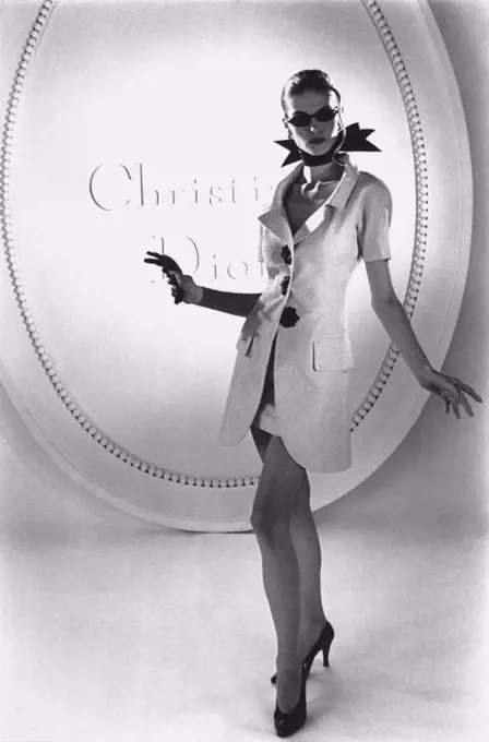 Fit at the shoulder-line is very important - especially so with a semi-straight jacket like this one from Dior's new collection. April 25, 1955.
