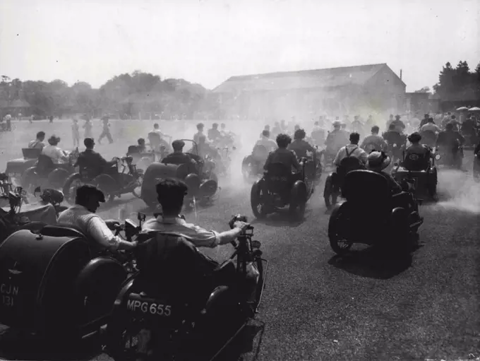The Invalid Kick Up A Dust... Annual Tricycle Race At Richmond Park... The Grand Parade as seen through the fog of dust and exhaust fumes - and sunshine, during the annual Invalid Tricycle Race at Richmond Park, yesterday. July 25, 1949. (Photo by Associated Newspapers Picture).