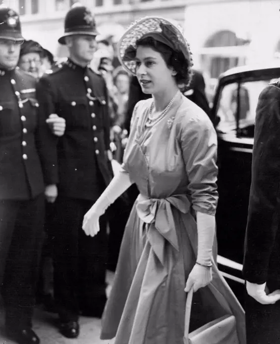 The Princess Pays A Call -- Princess Elizabeth arriving at the Travel Association's Information Centre in Whitcomb Street, London, this morning (Wednesday). Princess Elizabeth this morning (Wednesday) paid a visit to the Travel Association's Information Center in Whitcomb Street, London. July 20, 1949. (Photo by Reuterphoto). 