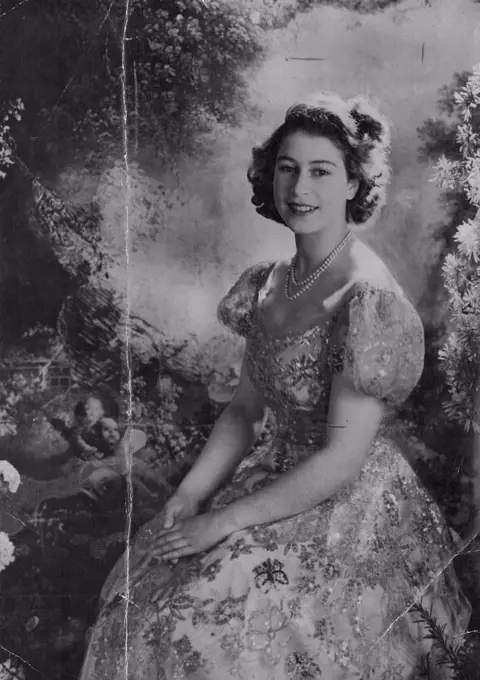 New Study Of Princess Elizabeth A charming portrait study of H.R.H. Princess Elizabeth, heir to the throne of Great Britain, taken by the artist-photographer Cecil Beaton, at Buckingham Palace, recently. Her Royal highness is wearing a rose colored lace and tulle picture dress embroidered in rose and gold with blue butterflies. June 7, 1947. (Photo by Associated Press Photo).