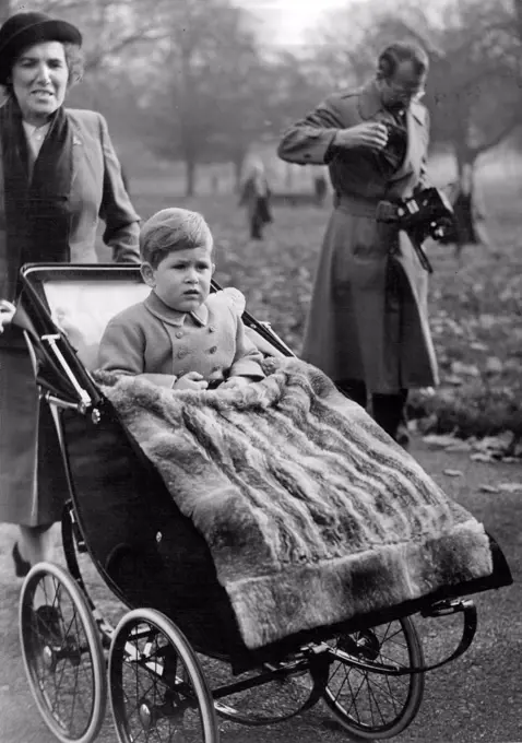 Birthday outing for Prince Charles -- A fur rug keeps Prince Charles warm on his third birthday outing in Green Park today. Prince Charles today celebrates his third birthday and as usual ***** outing in Green Park near his ***** home. In the absence of Princess ***** and the Duke of Edinburgh his grandmother of the Queen is supervising the birthday party arrangements. November 14, 1951. (Photo by Fox Photos).