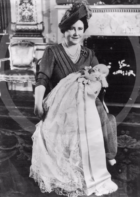 Queen Elizabeth With Her Granson-baby Prince Christened at Buckingham Palace. Queen Elizabeth of England, the child's grandmother, holding the baby Prince Charles after he had been christened with four names - Charles, Philip Arthur George - by the Archbishop of Canterbury, Dr. Geoffrey Fisher - at Buckingham Palace. the boy will be known as Prince Charles of Edinburgh. December 15, 1948. 