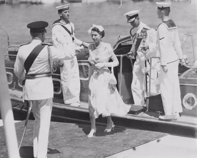 The Queen Steps Ashore -- The historic moment at Farm Cove when Queen Elizabeth II, followed by the Duke, leaves the barge to the salute of the Governor-General, Sir William Slim and the cheers of citizens who had awaited this moment for hours. February 15, 1954.