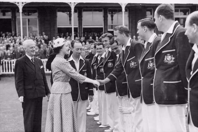 The Queen Visits Lords - And Meets The Australians -- The Queen is introduced to the Australian team by Lindsay Hassett, their captain. Her Majesty is shaking hands with Graham Hole. H.M. Queen Elizabeth visited Lords cricket ground where she was some of the play in the match between Australia and Middlesex. Her Majesty was introduced to the members of both teams. July 20, 1953. (Photo by Sport & General Press Agency Limited)