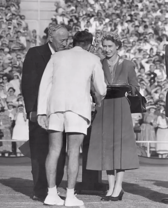 Pleasure showed on the Queen's face when she was introduced to Davis Cup players at Kooyong. March 15, 1954.