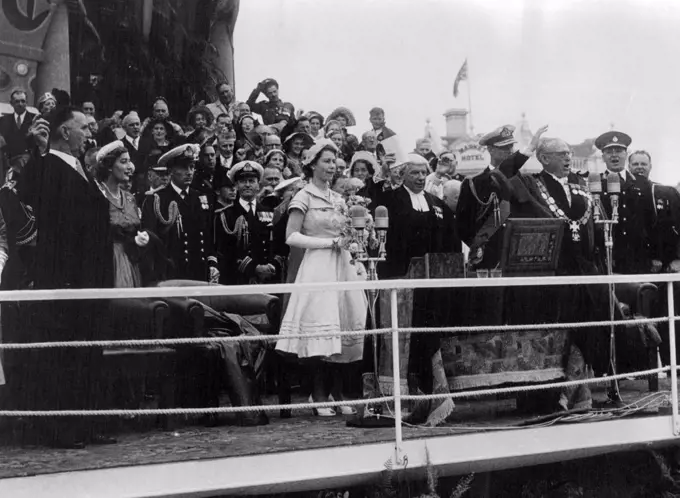 The Prime Minister of New Zealand, Mr. S. G. Holland (waving hand) leads three cheers for the Queen. December 31, 1953.