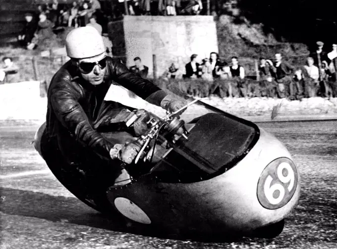 Practice For T.T. Races -- Ken Kavanagh, the Australian ***** the Moto Guzzi Italian team, at speed on his 500 c c Guzzi during practice on the Tourist Trophy Course on the Islands of Matain ***** for next week's *****. June 03, 1955.