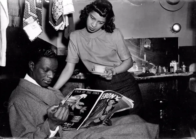 With his Fiancee, Marie Ellington, Cole reads reports of his wedding plans. September 23, 1948. (Photo by France Media Agency).