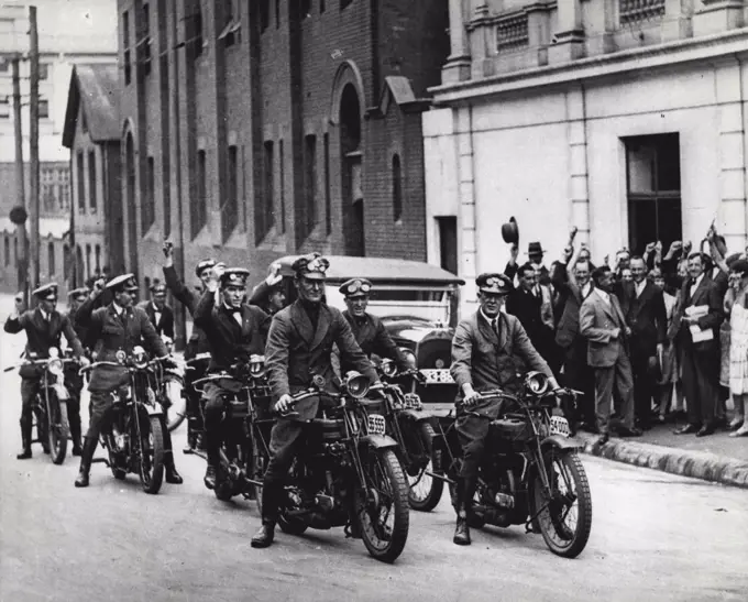 The first NRMA "guides" (patrols) line up outside the NRMA offices in Harrington Street to escort the association's (First) Secretary, Mr. Harold Johnson, on his way to a fact-finding tour of Britain, Europe & The USA. January 1, 1926.