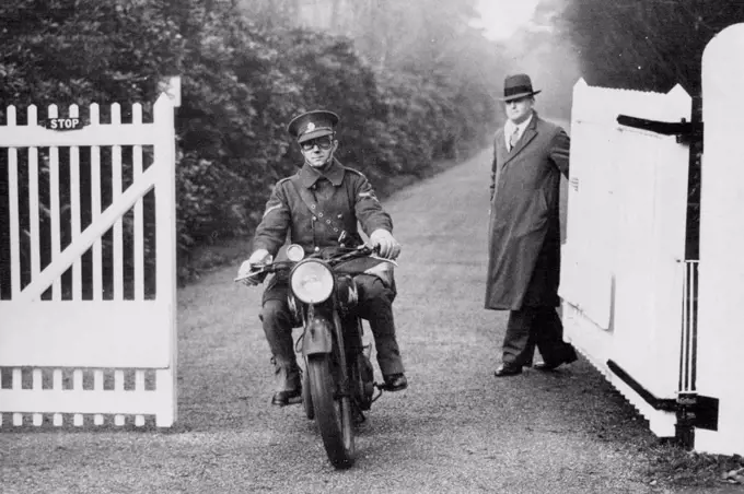 The Motor Cycle Dispatch Rider Leaving fort Belvedere with the Abdication act after the king Had Signed it this afternoon.King Edward's last state Documents Dispatch Rider takes Abdication act back to London after the royal Assent.Sunningdale, Berkshire, Eng, December 11- King Edward VIII Signed away his throne at Fort Belvedere, His Suburban home near here, this Afternoon. The Abdication Bill, which received its first reading in the house of Commons last Night, Passed Through Parliament at 1.52 P.M. today, and was taken by a motor-cycle Dispatch rider to fort belvedere for the "Royal Assent" - The King's Signature which made the bill a law. December 11, 1936. (Photo by Associated Press Photo).