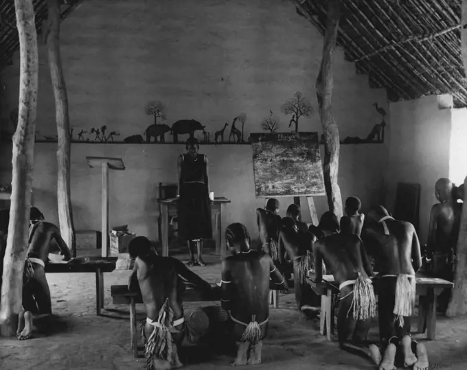 The Anglo-Egyptian Sudan.
Government-subsidized mission schools bring education to the children of the South. The teacher are nearly all Sudanese. The is a girls' school at the village of Yei. November 25, 1953. (Photo by Camera Press).