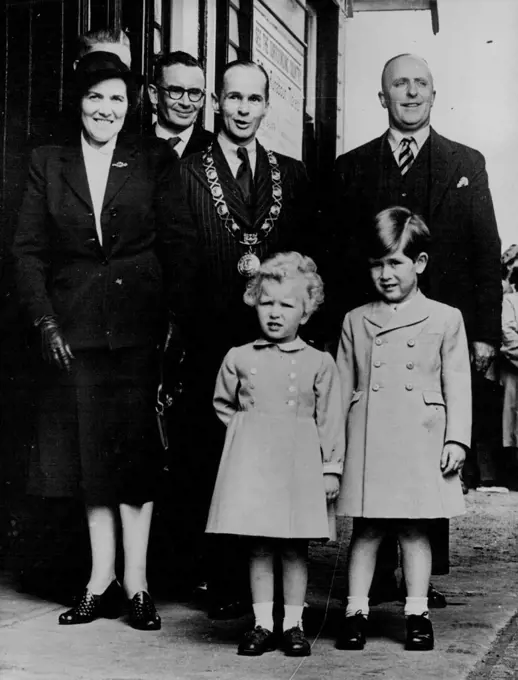Prince And Princess Leave Ballater Form London -- Prince Charles and his sister, Princess Anne pose for their photograph at Ballater station, Scotland, May 18th, before entraining for London after a holiday at Balmoral. At left is nurse Lightbody. Other persons not identified. November 15, 1954. (Photo by Associated Press Photo).