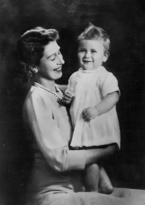 First-Birthday Portrait of Prince Charles With His Mother :A charming first-birthday portrait, by Marcus Adam, of the baby Prince Charles with his mother Princess Elizabeth.The young Prince - who now weighs over 24 pounds, and who is talk for his age - celebrates his birthday on November 14th. November 12, 1949.