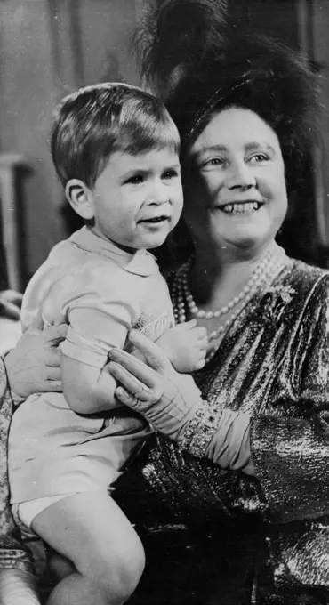 1950... The young Prince with Elizabeth now the Queen Mother. November 11, 1950. (Photo by The Associated Press Ltd.).