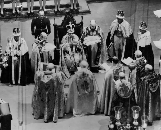 The Coronation of King George VI. And Queen Elizabeth -- The crowned King George VI seated on the Coronation Chair in Westminster Abbey during the ceremony. May 12, 1937. (Photo by The "Topical" Press Agency Ltd.)