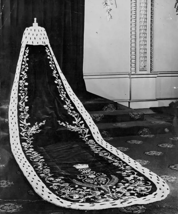 Robe Of State - The purple robe of state worn by the Queen Mother at her coronation in 1937. Elizabeth II has chosen this type of robe -- hanging from the shoulders and worn with a magnificent dress. The embroidery design will be different. December 3, 1952.