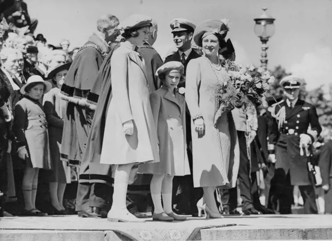 King And Queen Leave Portsmouth for Canada -- The King and Queen with Princess Elizabeth and Princess Margaret on the steps of the Guildhall when the King received the Keys of Portsmouth.As Princess Margaret cried and other members of the Royal family waved good-bye from the dockside, the King and Queen left Portsmouth on the liner "Empress of Australia" for their state Visit to Canada and America. The liner was escorted by Warships. Previously at the Guildhall - revival of an old custom last observed in 1842. May 06, 1939.