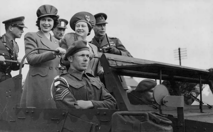 Princess Elizabeth Makes Her First Full-Length Tour Of Inspection -- The Royal Party in a scout car during their inspection of Royal Artillery.On a recent inspection of troops the King was accompanied by the Queen and Princess Elizabeth, it was the first time the Princess had made a Full-length tour with her parents. Scottish troops and armoured infantry were among those visited.The King and Queen and the Princess rode in jeeps their majestics were interested in new developments in the battle organisation of the Royal Army Medical Corps. April 01, 1944. (Photo by British Official Photograph).