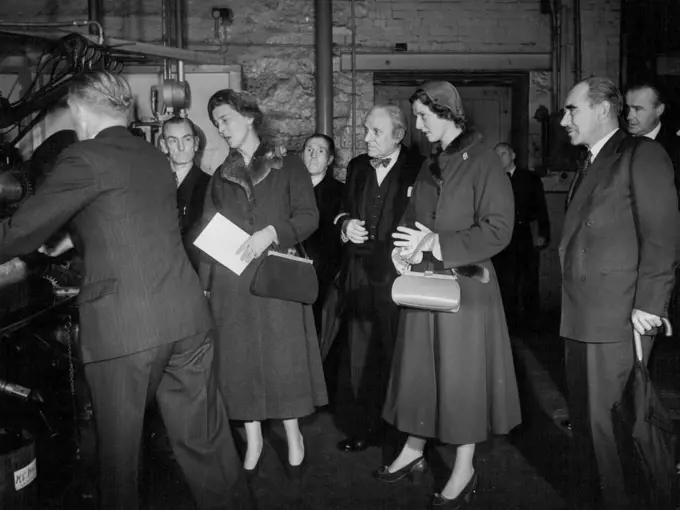 First Official Tour For Prince's Alexandra - 16 year old Princess Alexandra of Kent went on her first official tour yesterday a trip to Lancashire's cotton belt. Her mother, the Duchess of Kent went with her. The Duchess and her daughter stop to look at machinery at the Calico Printing works at Accrington. October 13, 1953. (Photo by Daily Express Picture).